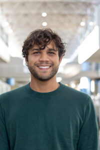 Jordan Metzler stands inside the Art and Architecture Building.