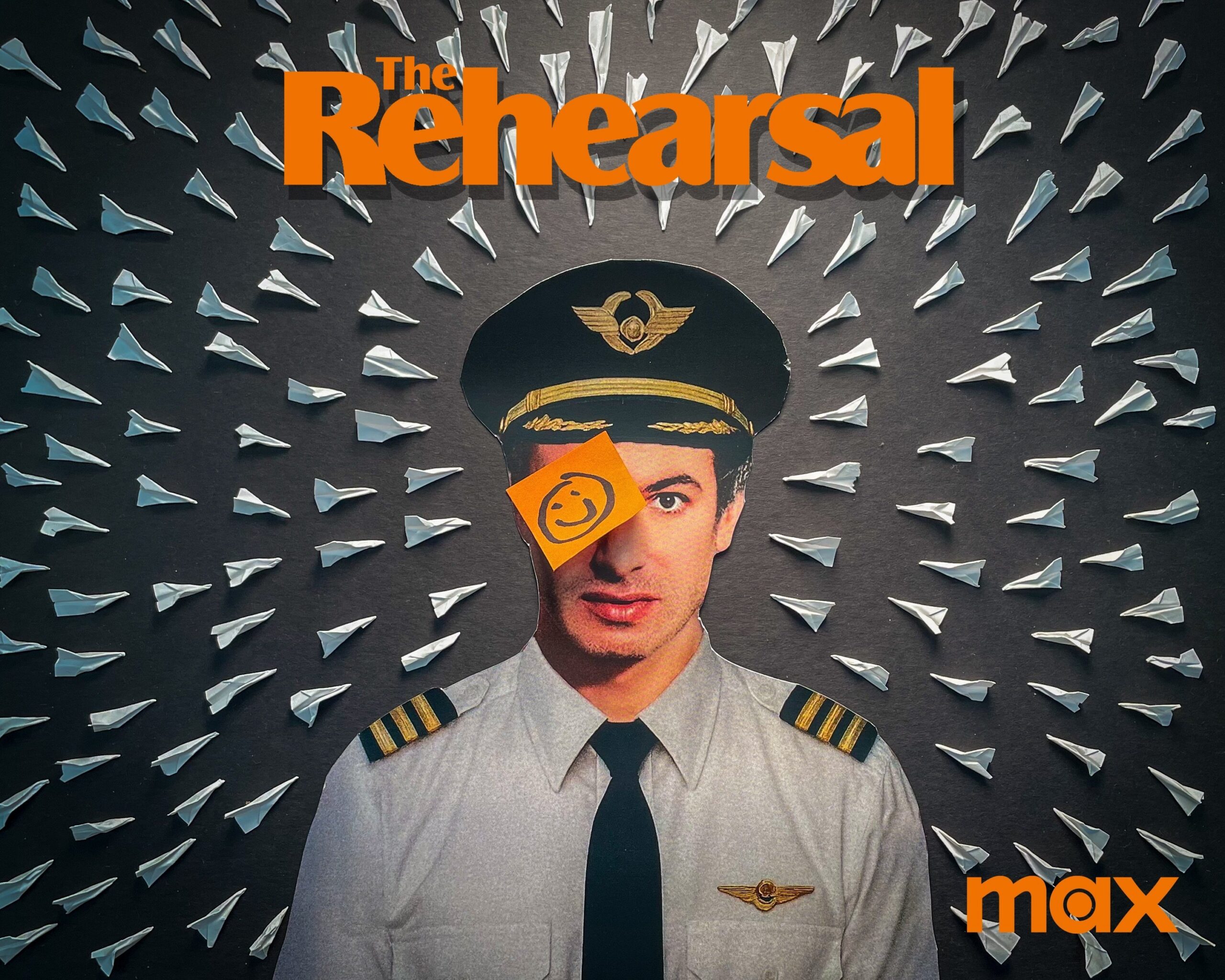 Student artwork of Nathan Fielder wearing a pilot uniform with paper airplanes surrounding him pointed towards his body. A sticky note with a smiley face covers his left eye.